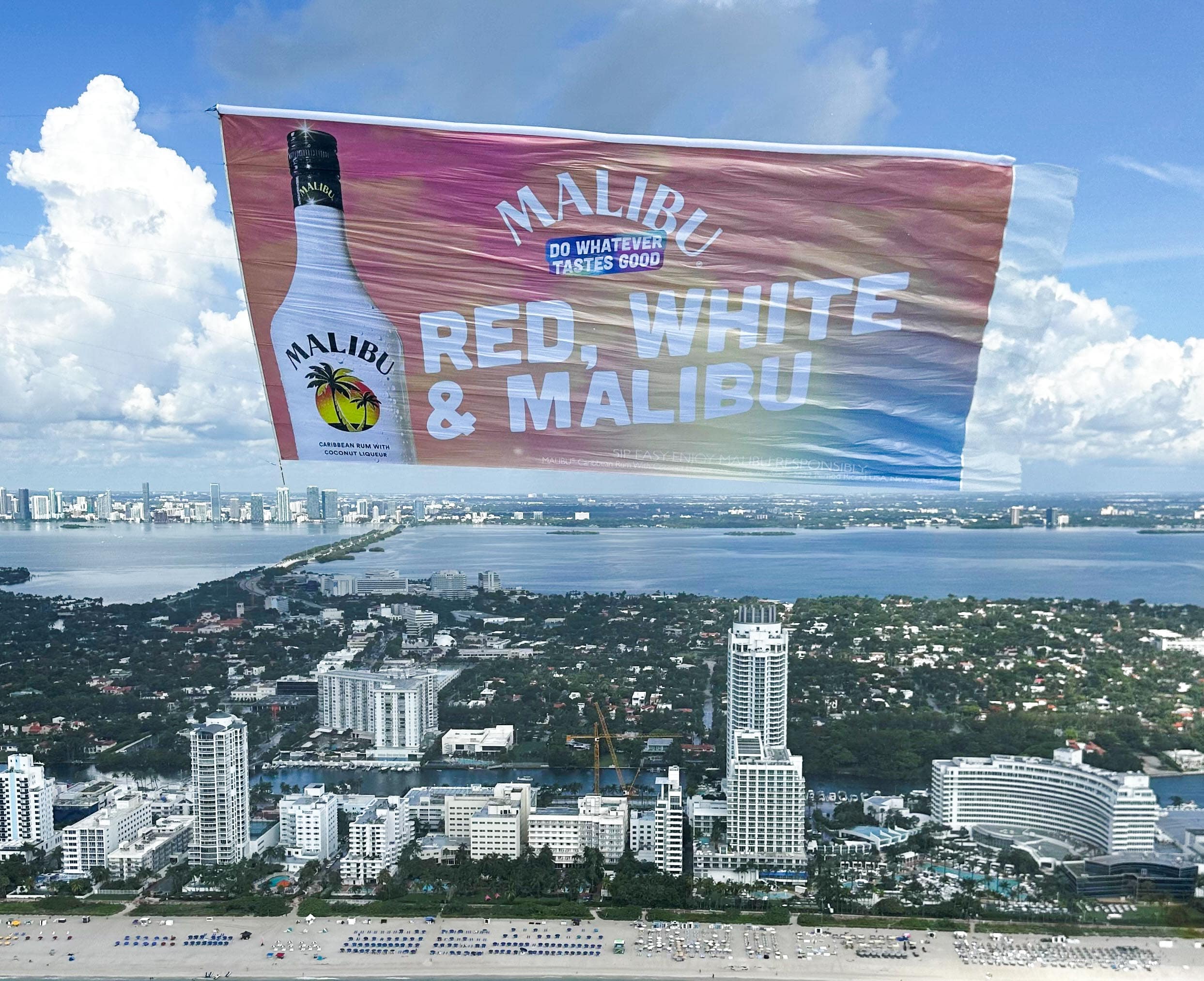 Liquor ad beach flyover, Beachside rum aerial banner