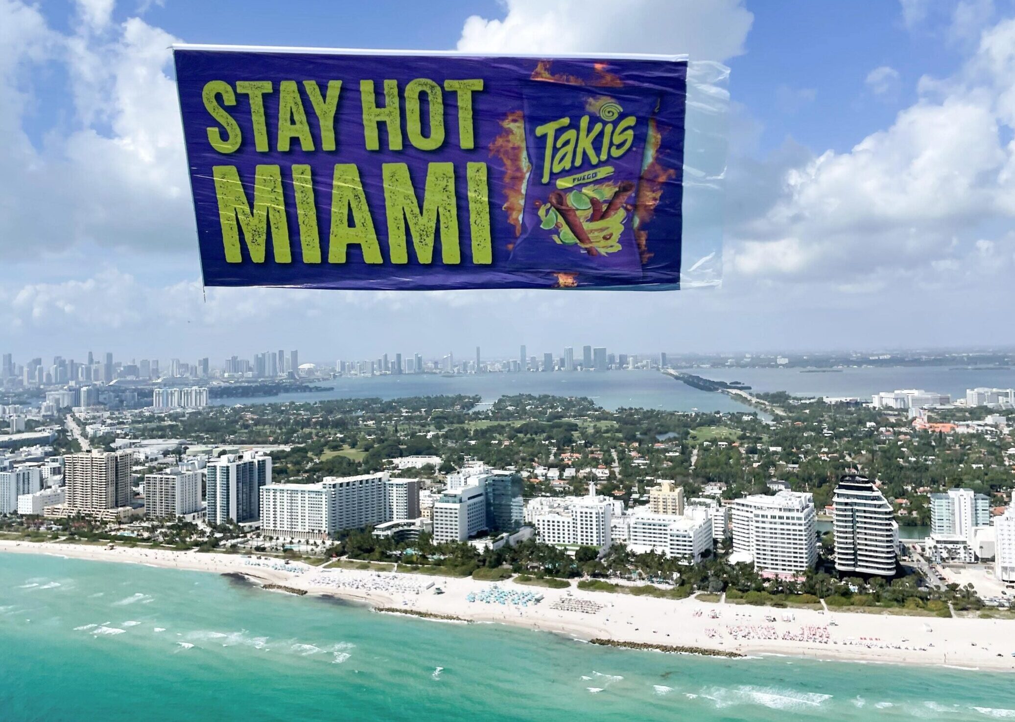 Spicy snack beach banner, Miami snack ad aerial