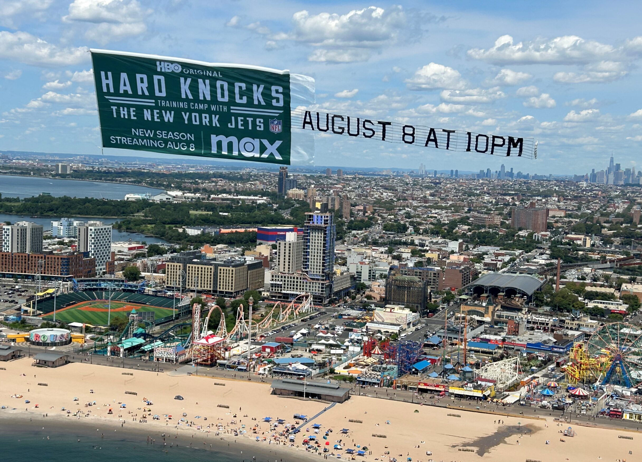 TV show banner over beach, Aerial sports series advertisement